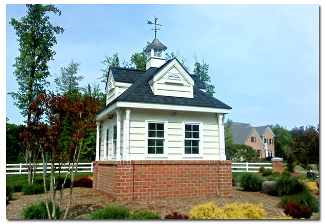 cupola with golfer weathervane on a small building